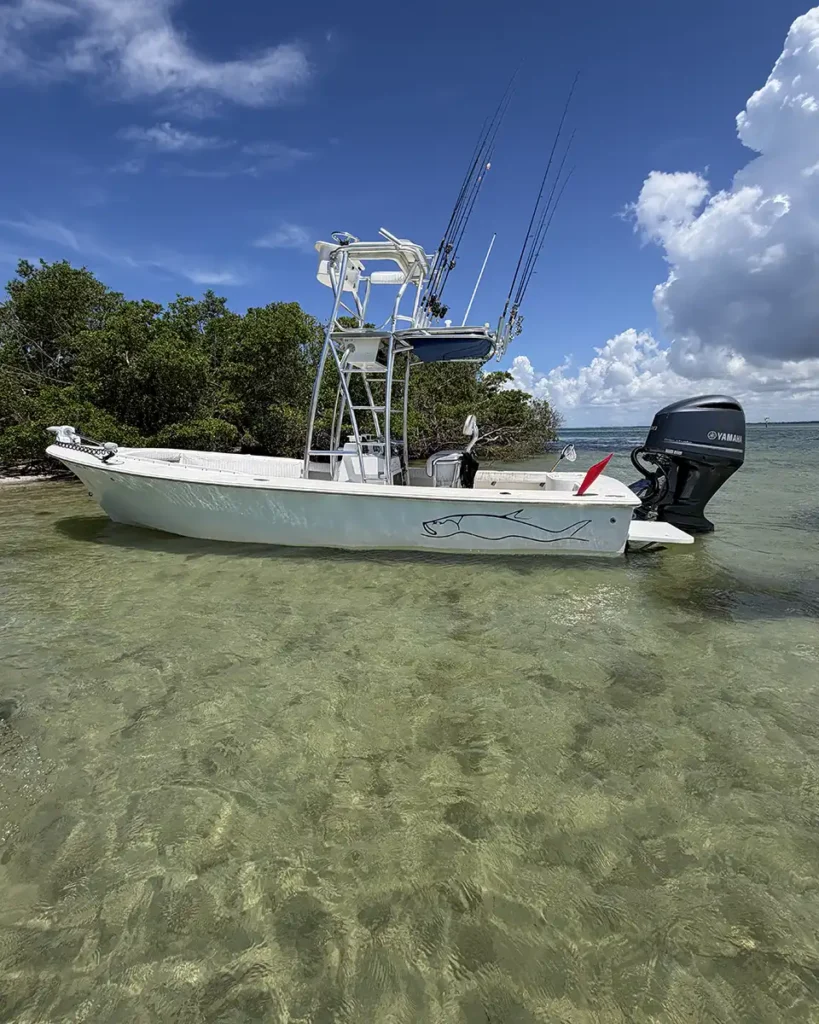Charter fishing boat in shallow water on Sarasota Bay, Florida