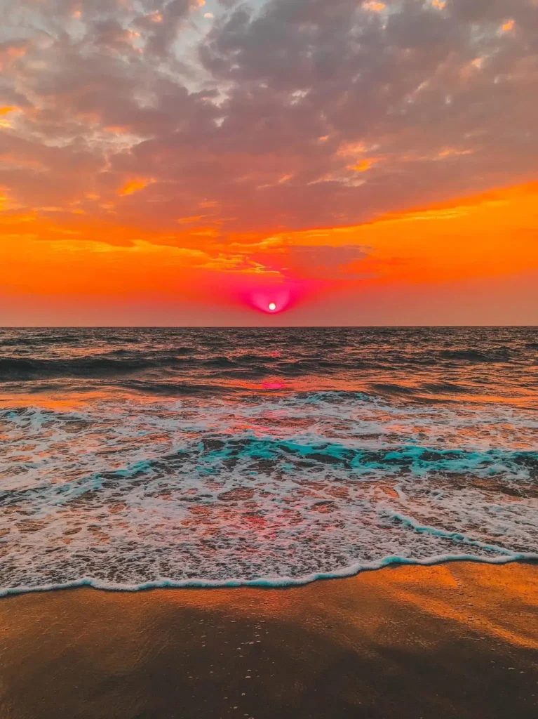 Brilliant sunset over the Gulf of Mexico near Sarasota during an evening sunset cruise with colorful skies and rolling waves.